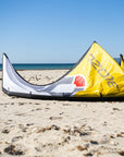 The Ozone Catalyst V3 on Yellow laying on a golden sand beach.