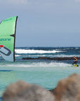 Green Alpha V2 flying low in turquoise water