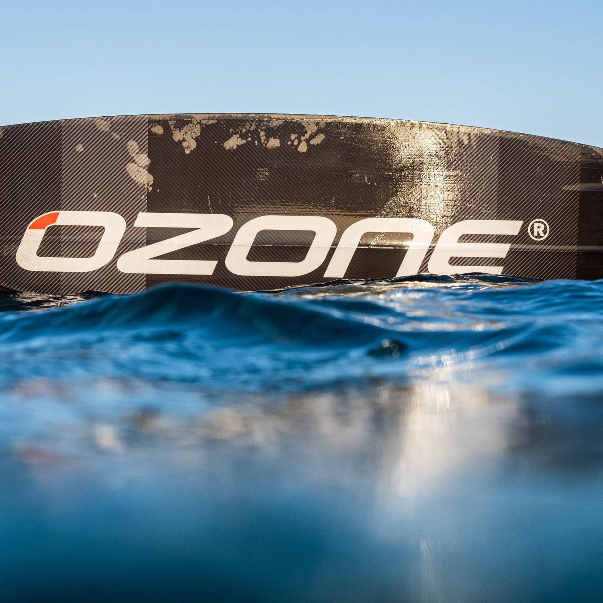black Ozone Code v3 kitesurfing board in water